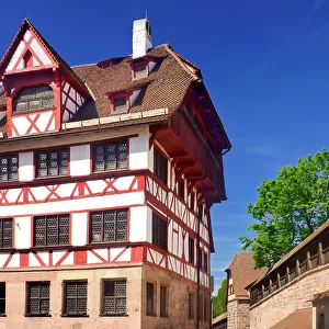 Germany, Bavaria, Nuremberg, Albrecht Durer Haus, Home of the German Renaissance artist with city ramparts behind
