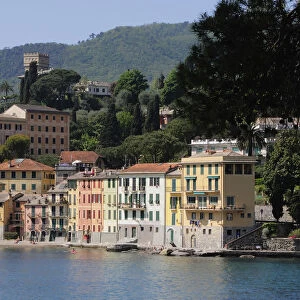 Italy, Liguria, Portofino Peninsula, colourful houses & waterfront near Portofino