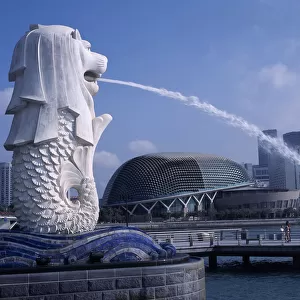SINGAPORE, Merlion Park Merlion statue and fountain in foreground with new esplanade