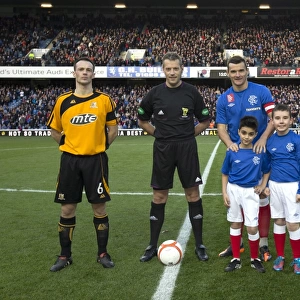 Rangers Triumph: Lee McCulloch and Mascots Celebrate Historic 7-0 Scottish Cup Victory at Ibrox Stadium