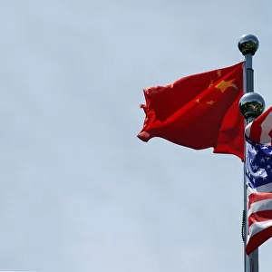 Chinese and U. S. flags flutter near The Bund in Shanghai