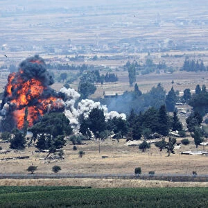An explosion is seen at Quneitra at the Syrian side of the Israeli Syrian border as it is