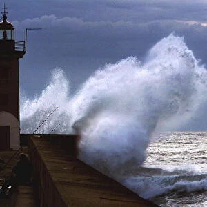 FISHERMEN TAKE SHELTER NEAR THE DOURO RIVER LIGHTHOUSE DURING A STORM