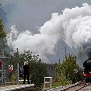 The Flying Scotsman steam train passes through Pitlochry, Scotland