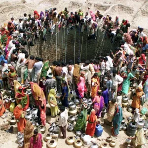 Print of People Gathered Around a Village Well Print of People Gathered Around a Village Well