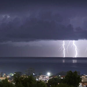 Lightnings strike in the sea off the shore of Artemida