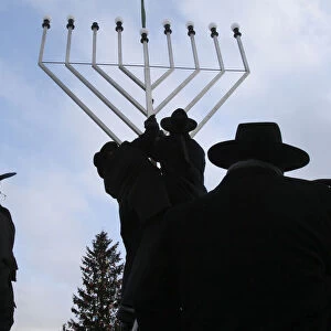 Rabbis inspect the setting-up of a large Menorah in front of the Brandenburg Gate in