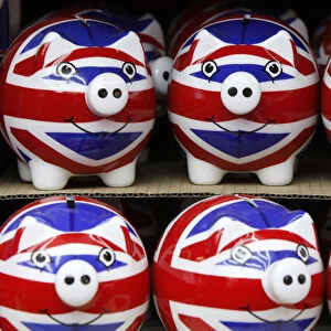 Row of piggy banks adorned with the colours of Britains Union Jack flag are seen in a