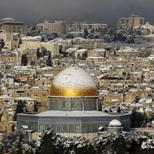 Snow covers the Dome of the Rock on the compound known to Muslims as al-Haram al-Sharif