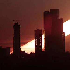 The sun rises behind the skyscrapers of the Moscow International Business Centre in