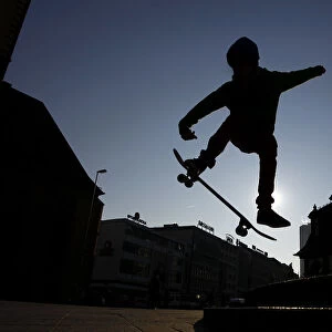 A young skateboarder performs a jump near the Hauptwache during a freezing cold