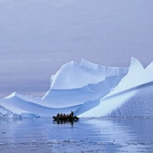 Tourists on Zodiac cruise around icebergs on the Antarctic Peninsula, Antarctica, January