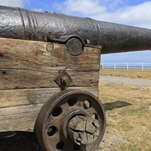 18th Century 18-pounder gun on seafront of seaside town, Gun Hill, Southwold, Suffolk, England, may
