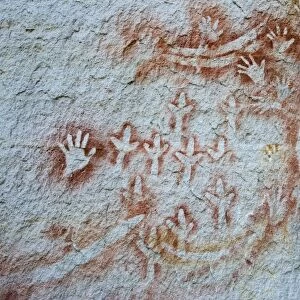 Aboriginal rock art, stencil art dated circa 2000 years old, showing depictions of hands, boomerangs
