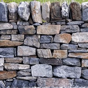 Drystone wall, section of recently finished wall with courses, tie and cap stones, Aberdeenshire, Scotland