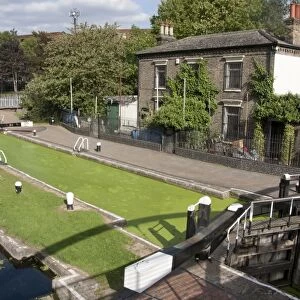 Lockgates with canal covered in green algae, Salmon Lane Lock, Regents Canal, Tower Hamlets, London, England, september