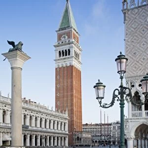 View of city square with Lion of Saint Mark on column and belltower of Roman Catholic cathedral, Leone Di San Marco