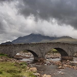 View of moorland river with old Sligachan Bridge and mountains, Sgurr nan Gillean, Cuillin Mountains, Glen Sligachan