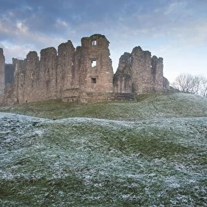 View of ruined castle in frost at dawn, Brough Castle, Church Brough, Kirkby Stephen, Cumbria, England, December