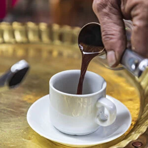 Africa, Egypt, Cairo. Egyptian coffee being served traditionally at a coffee shop in