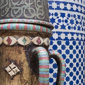 Africa, Morocco, Fes. Vase and pillar details with traditional design in the interior