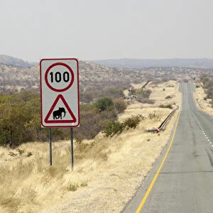Africa, Namibia, Etosha National Park. Speed limit and elephant caution sign. Credit as