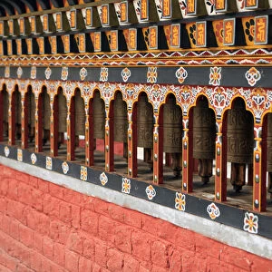 Asia, Bhutan, Thimpu. Prayer Wheels of the cnetral square in Thimpu