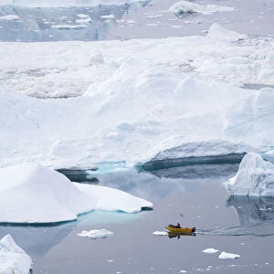 Boat at Ilulissat Icefjord, a UNESCO World Heritage Site, also called kangia or Ilulissat