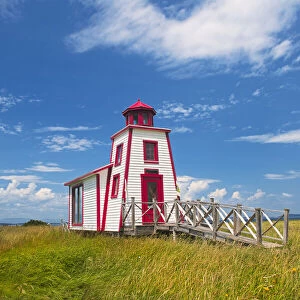 Canada, Quebec, Kamouraska. Lighthouse on shore of St. Lawrence River