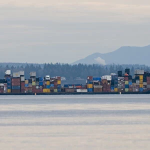 Colorful load on barge in Admiralty Inlet between Whidbey Island and Olympic Peninsula