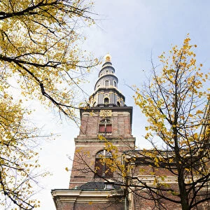 Copenhagen, Denmark - Low angle view of an ornate spire on an old world church. Vertical