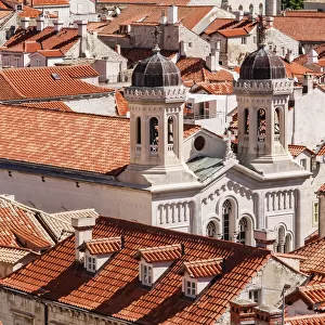 Croatia. Dalmatia. Dubrovnik. Church among red terra cotta tile roofs in the old town of