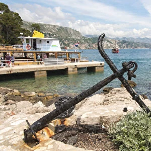 Croatia, Dubrovnik. Ferry dock Lokrum Island framed by old anchor