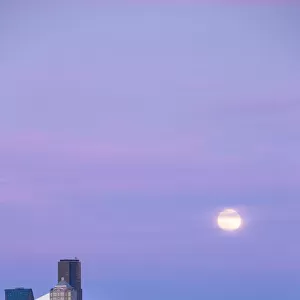 Downtown Seattle with a full moon rising in the evening sky, Seattle, Washington State