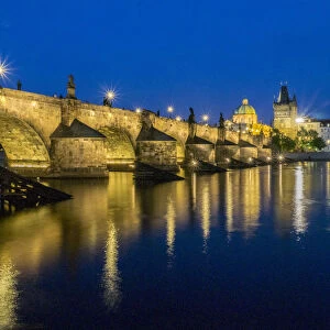 Europe, Czech Republic, Prague. Charles bridge water reflection at night