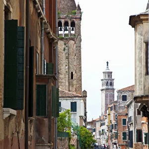 Europe; Italy; Venice; Gondoleirs Traveling Back Canal