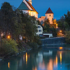 Germany, Bavaria, Fussen, Franciscan Abbey church and Lech River, evening