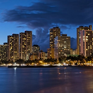 Hawaii Honolulu twilight of Waikiki Beach at night with colorful sky in Oahu