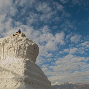 India, Ladakh, Leh, capital of Ladakh white chorton against a cloud filled blue sky