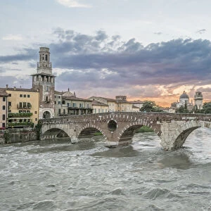 Italy, Verona. Ponte Pietra (Roman Bridge) at Sunset