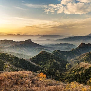 Jinshanling Mountains at sunrise in autumn colors, from Great Wall of China, Jinshanling