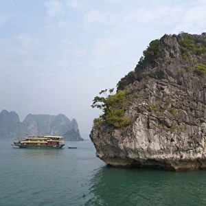 Junk boat and karst islands in Halong Bay, UNESCO World Heritage site