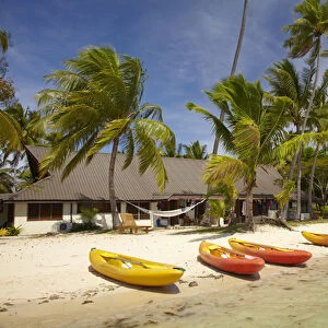 Kayak on the beach, and waterfront bure, Plantation Island Resort, Malolo Lailai Island