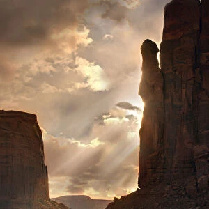 Light rays filter down into Monument Valley, on the Arizona and Utah border