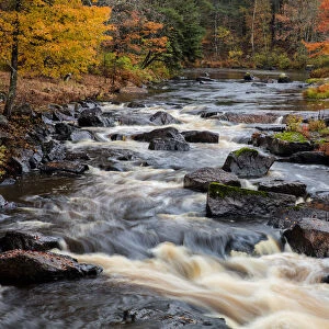 The Middle Branch of the Escanaba River Rapids in autumn near Palmer, Michigan USA