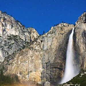 Moonbow and starry sky over Yosemite Falls, Yosemite National Park, California