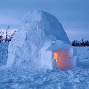 NA, Canada, Manitoba, Churchill. Arctic igloo with candle light inside