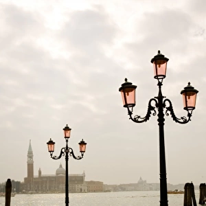 Ornate lamposts near the water, Venice, Italy