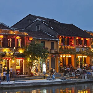 Restaurants reflected in Thu Bon River at dusk, Hoi An (UNESCO World Heritage Site)
