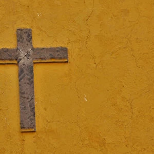 San Miguel De Allende, Mexico. Cross mounted on buildings wall